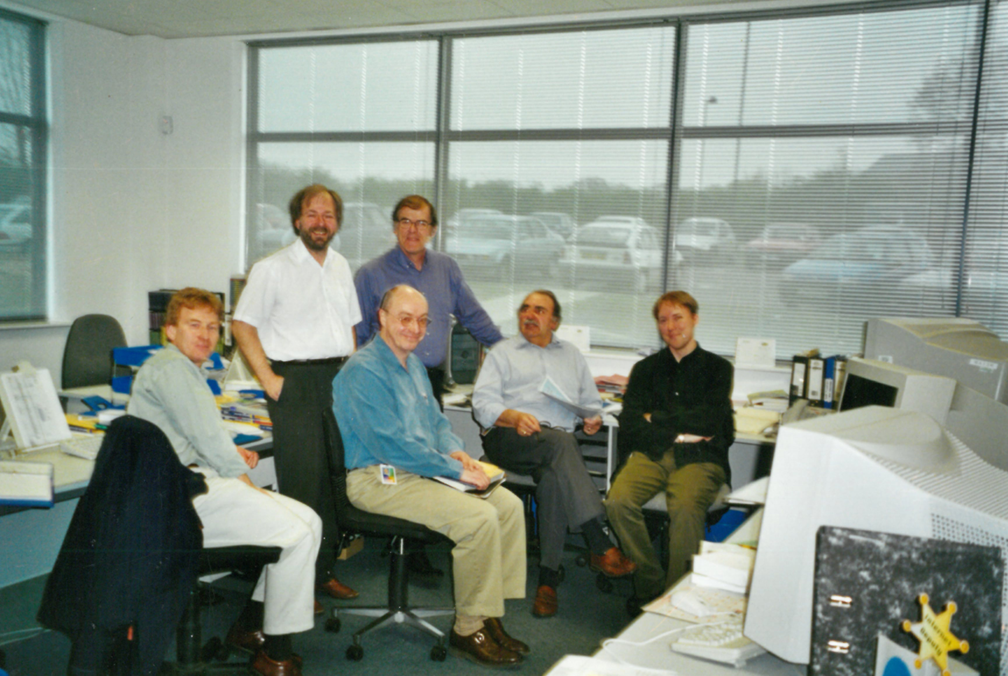 John Blanchard, 2nd from left (standing), with the Catalogue Production team in 2000.
