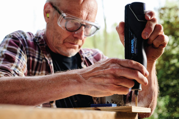Man using dremel drill