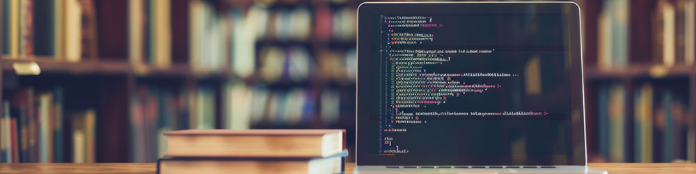 Library setting with a piece of code on a laptop