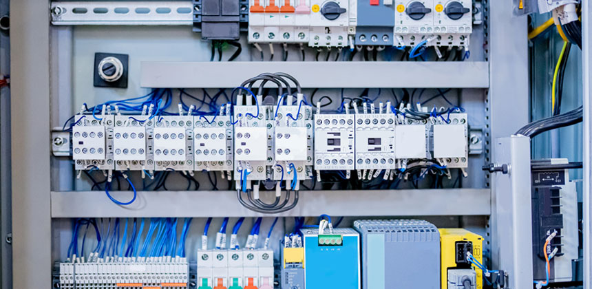 Industrial control panel with DIN rail mounted components, terminal blocks and wiring trunking