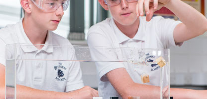 Students using density cubes