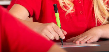 Student using Show-me board and pen