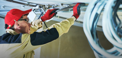 Worker using Unistrand cabling